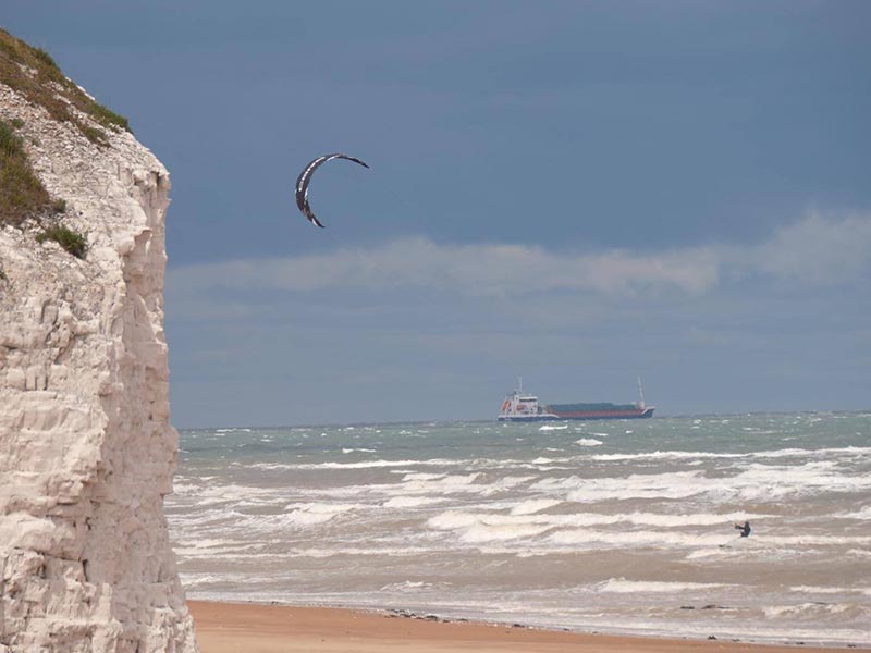 Kitesurfing – kitesurfer near a cliff